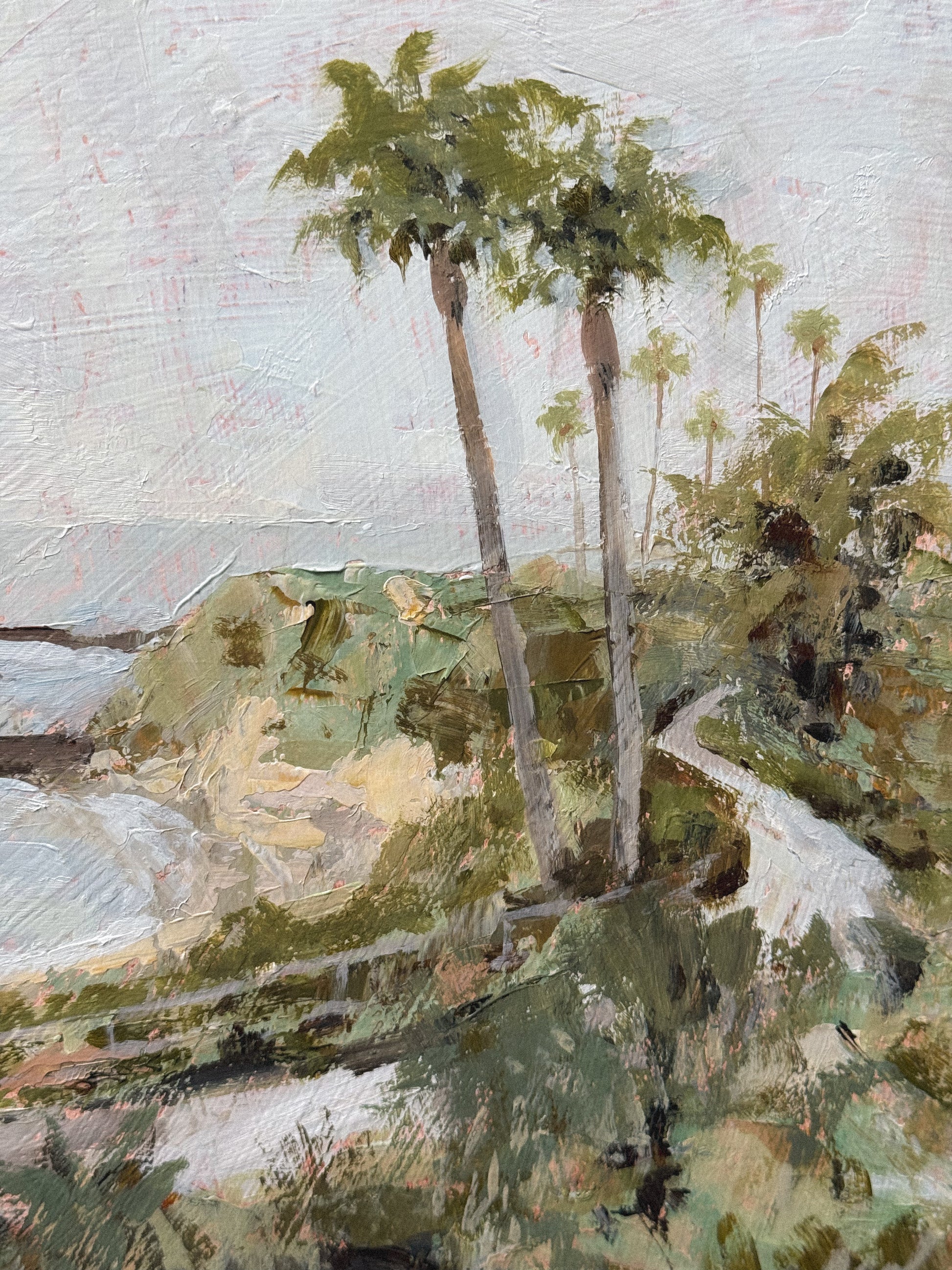 An acrylic painting in a floater wood frame, depicting the view of Treasure Island from the Montage Resort in Laguna Beach, CA. 